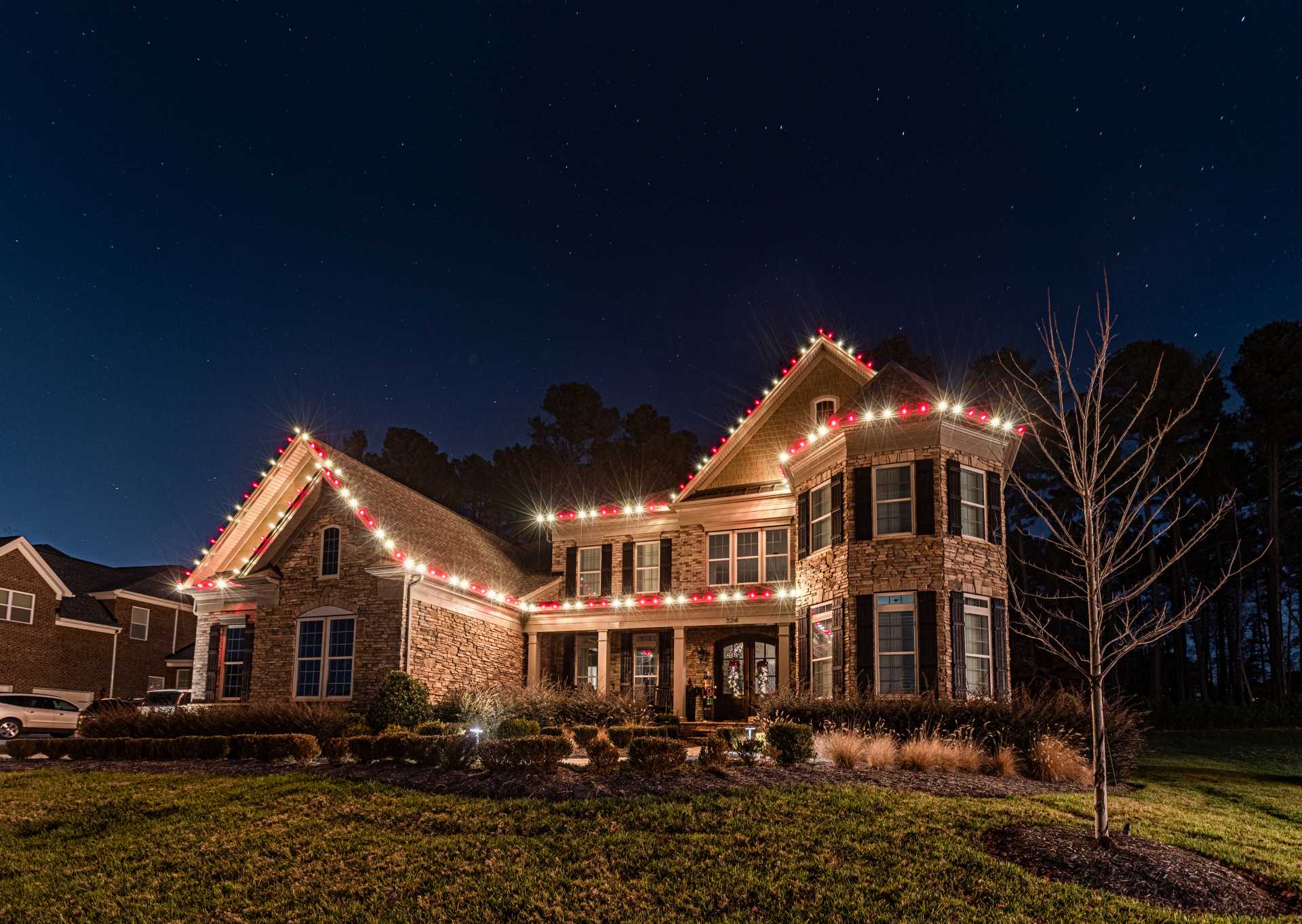 Warm white residential Christmas lights on a Lake Oconee home